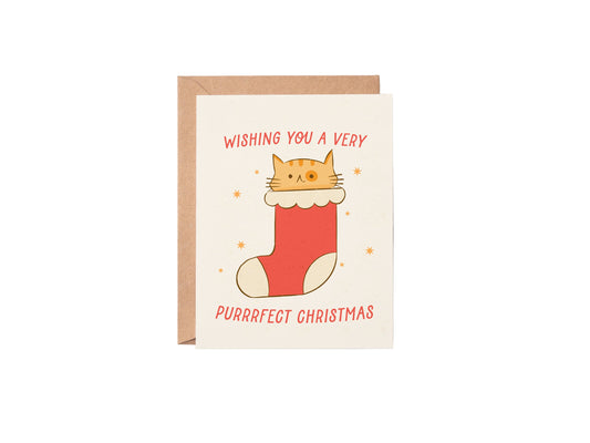 Christmas card with a cat in a stocking and 'Purrfect Christmas' text on a white background
