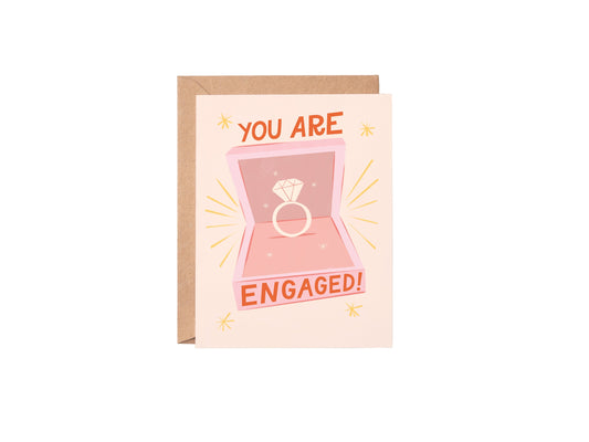 Greeting card with 'You are engaged!' text and ring illustration on a white background