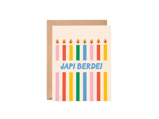 Greeting card with colorful candles and 'Japi Berdei!' text on a white background